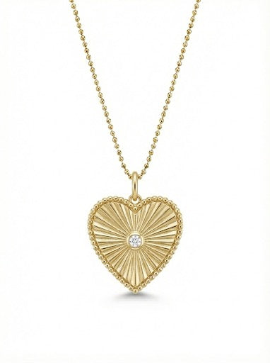 14Kt gold heart pendant featuring a single diamond