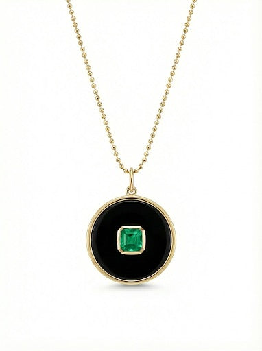 14Kt gold onyx disc pendant with single emerald