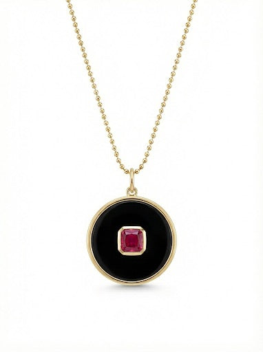 14Kt gold onyx disc pendant with single ruby
