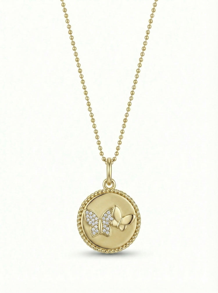14Kt gold disc pendant featuring 2 butterflies -diamond encrusted